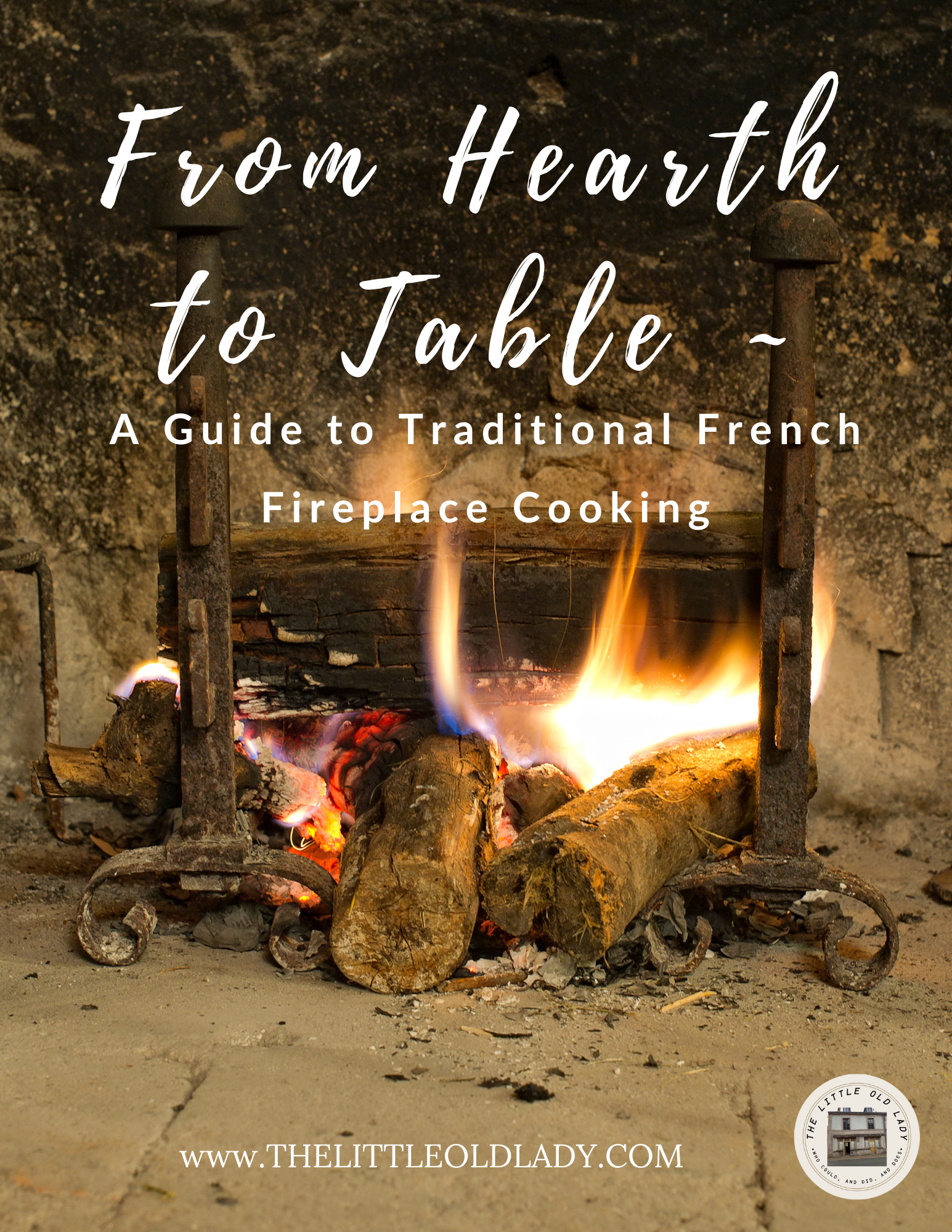 Cover of From Hearth to Table: A Guide to Traditional French Fireplace Cooking, showing a wood fire burning between two iron andirons in an old stone hearth